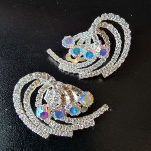 Brilliant aurora borealis rhinestone statement swirl clip on earrings